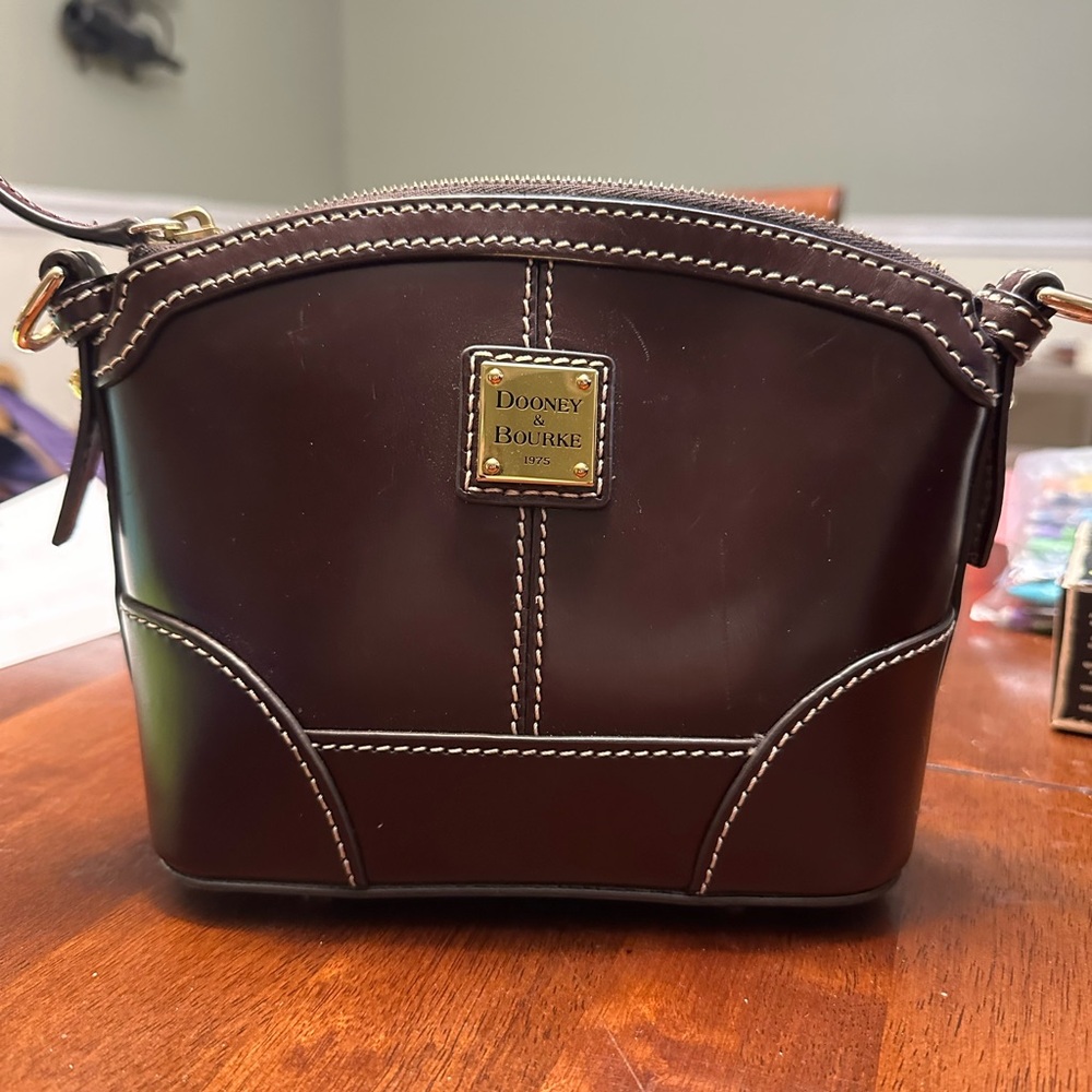 Dooney & Bourke Penrose Mini Domed Crossbody in deep purple.